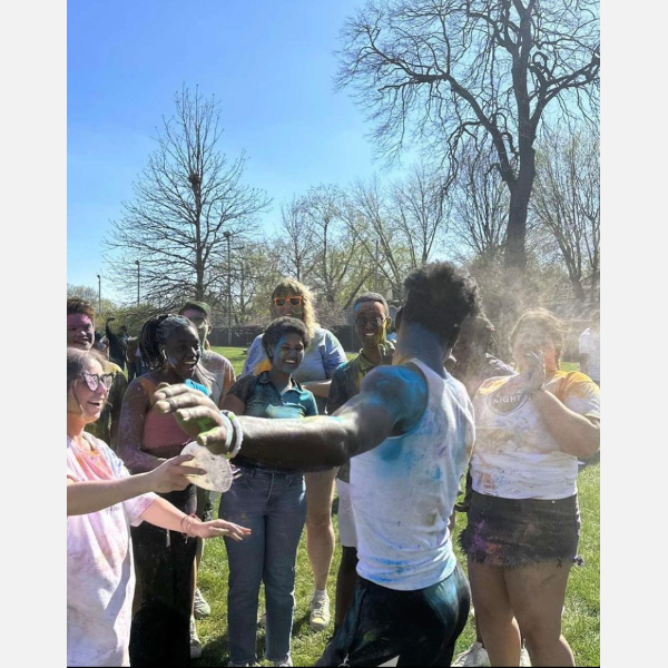 Students coat each other in colorful powder as they celebrate Holi on campus, as organized by the Indian Student Association