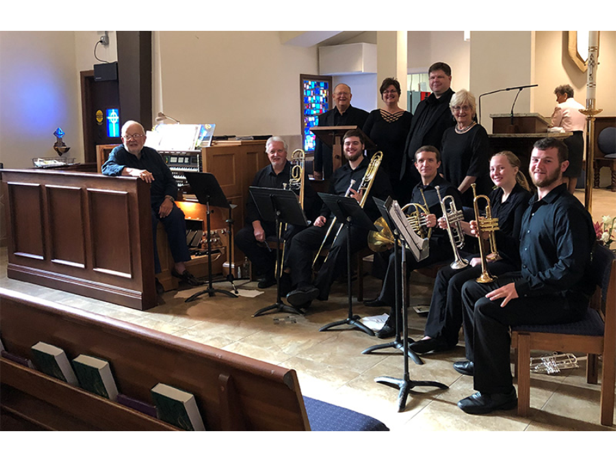 Roszell with the music staff of the Tabernacle Choir at Temple Square in Salt Lake City.