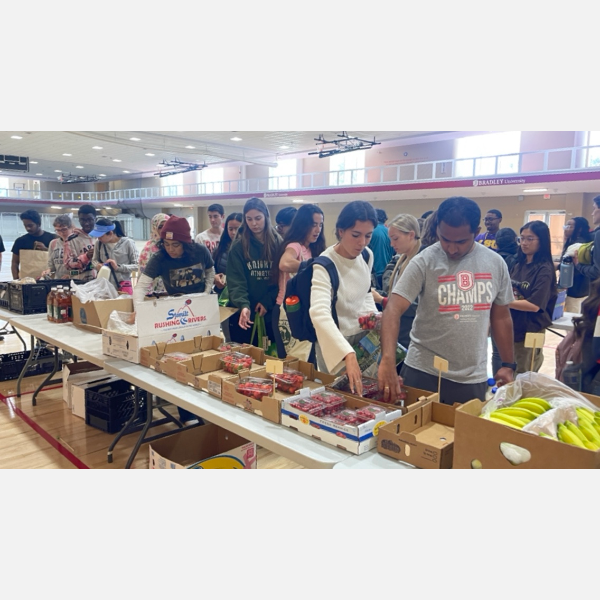 Students and community members gather in droves to purchase some of Market 309's fruits and vegetables