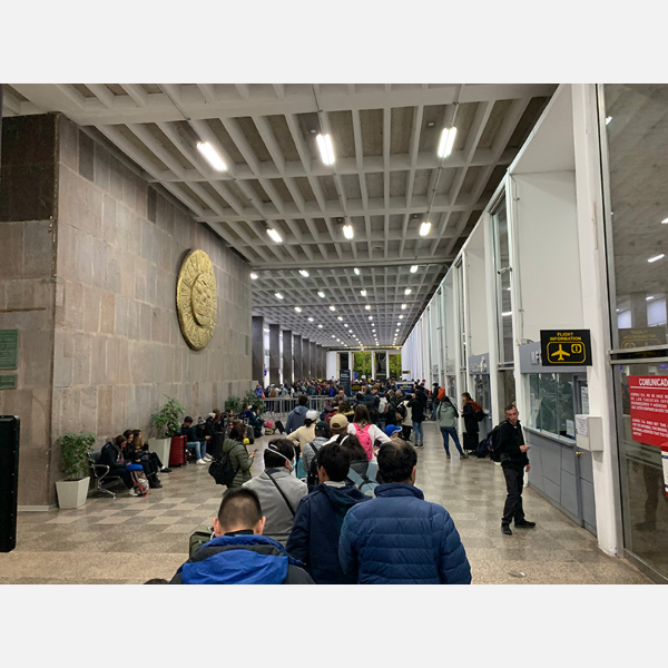 Hundreds of people mass at the airport in Cusco, Peru, trying for a flight out after the government announced the country was being closed due to the coronavirus.