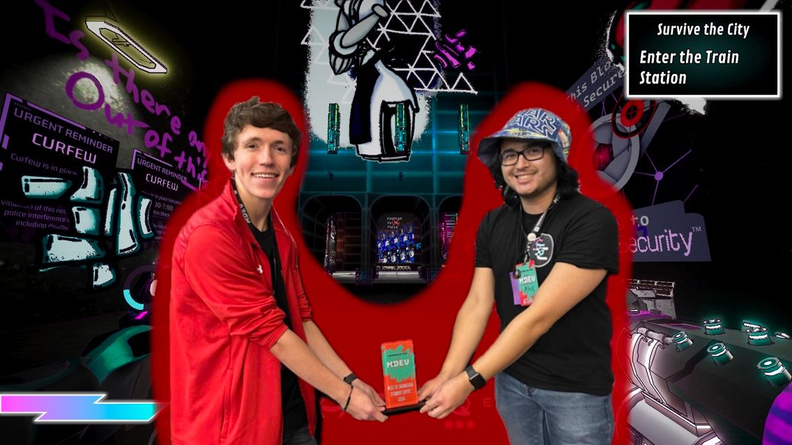 Kadin White ’24 and Alex Koeberl ’24 pose with their MDEV Best in Showcase Student Entry trophy, superimposed over a screenshot of their game, SoulSync City