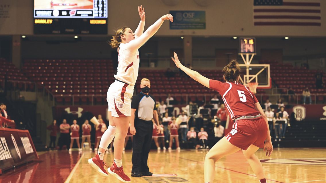 Gabrielle Haack taking a shot over the defender.
