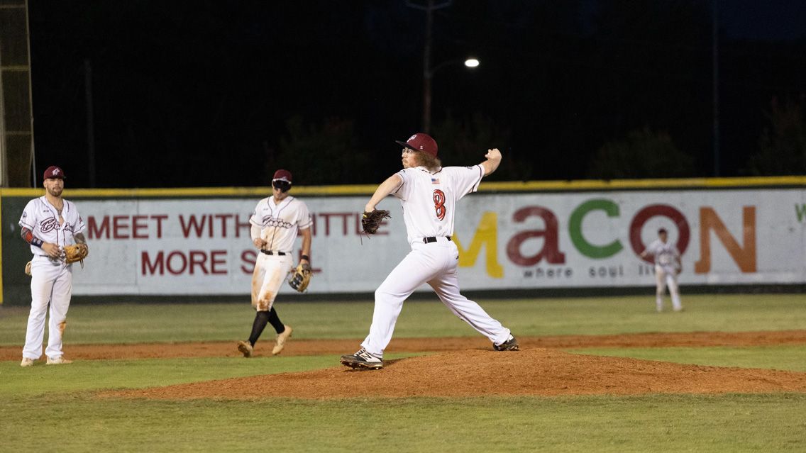 Skye Gillespie on pitcher's mound throwing a pitch.