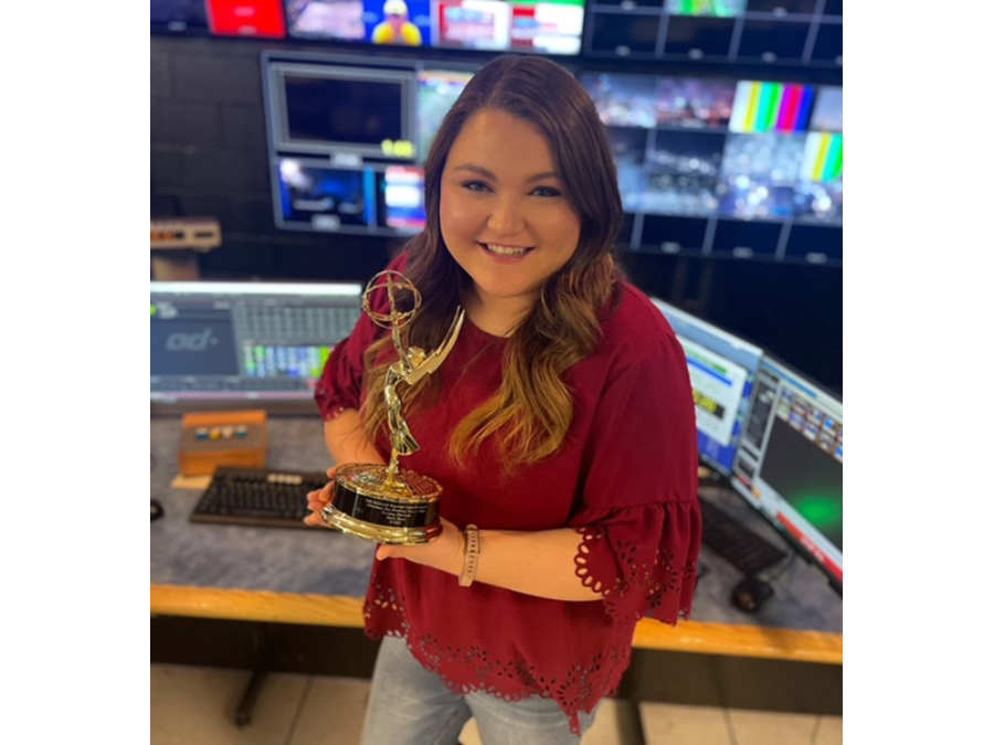 Molly Horst ‘15 holding her Emmy award