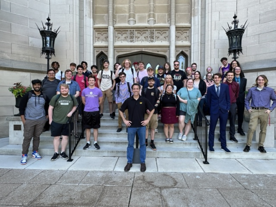 Bradley CS 390 students pose with a representative from Caterpillar