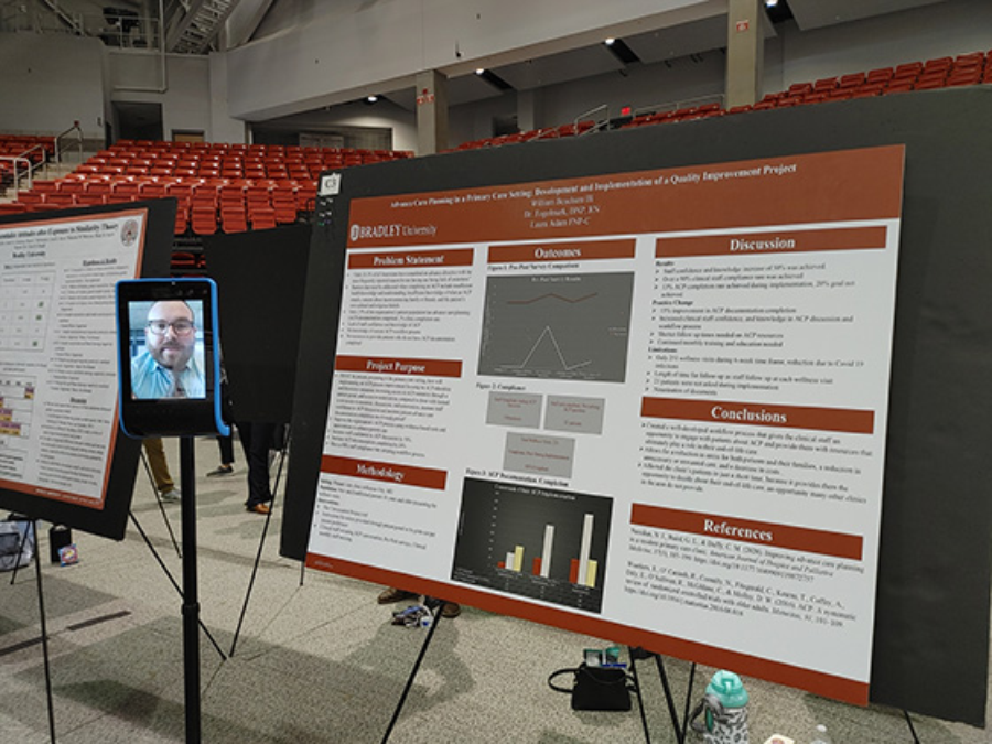 Wil Beachum with his capstone project poster.
