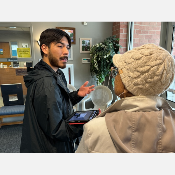 PeoriaFresh team member Brian Sida explains the benefits of using their platform to request produce for food banks